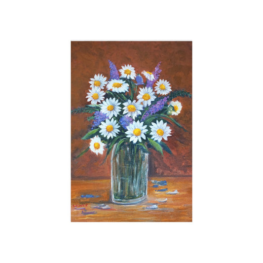 Daisies and purple flowers in a glass vase